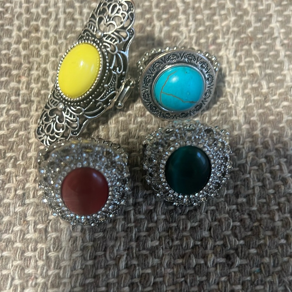 4 Rings… Costume Jewelry… stretchable bands